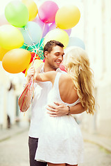 Image showing couple with colorful balloons