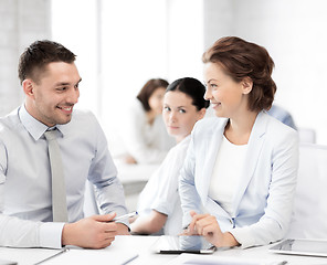 Image showing usiness colleagues talking in office