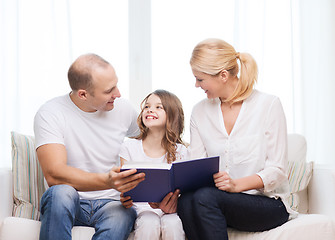 Image showing smiling parents and little girl with at home