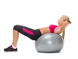 Image showing smiling woman with fitness ball