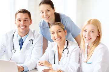 Image showing group of doctors with laptop computer