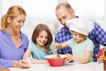 Image showing happy family with two kids eating at home