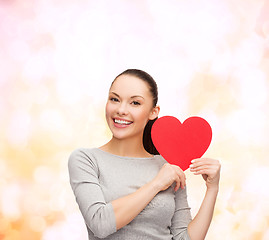 Image showing smiling asian woman with red heart