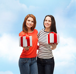 Image showing two smiling teenage girls with presents