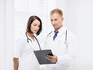 Image showing two doctors writing prescription