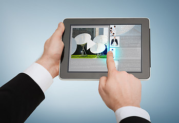 Image showing close up of man hands touching tablet pc