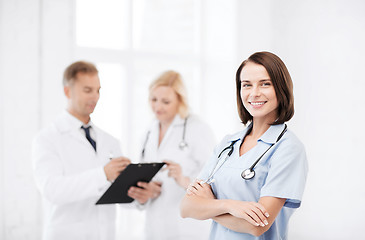 Image showing young female doctor with stethoscope