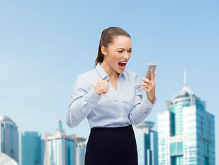 Image showing screaming businesswoman with smartphone