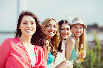 Image showing girls with drinks on the beach