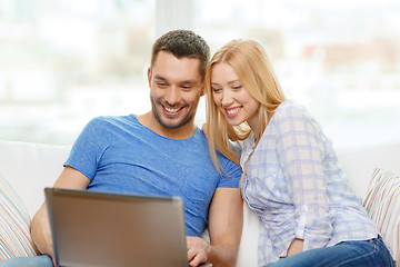 Image showing smiling happy couple with laptop at home