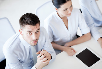 Image showing serious businessman on meeting in office