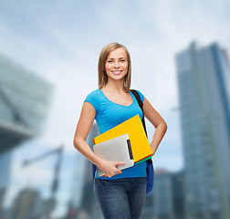 Image showing smiling student with bag, folders and tablet pc