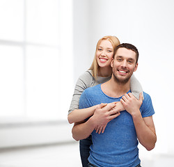 Image showing smiling couple hugging