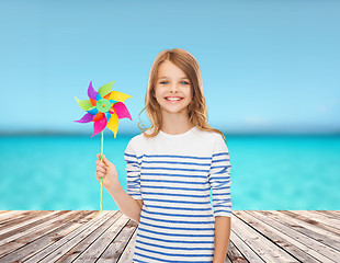 Image showing smiling child with colorful windmill toy