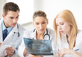 Image showing young group of doctors looking at x-ray