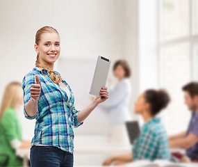 Image showing smiling girl with tablet pc computer at classroom