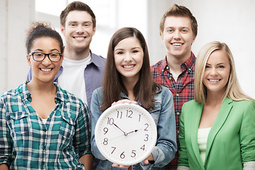 Image showing group of students at school with clock