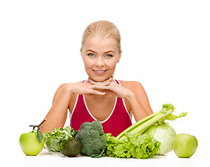 Image showing smiling sporty woman with organic food