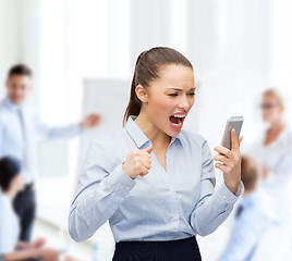 Image showing screaming businesswoman with smartphone