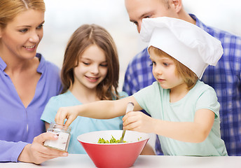 Image showing happy family with two kids eating at home