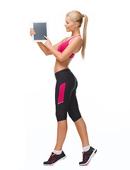 Image showing sporty woman with tablet pc