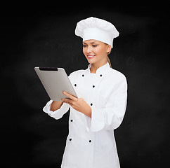 Image showing smiling female chef with tablet pc computer