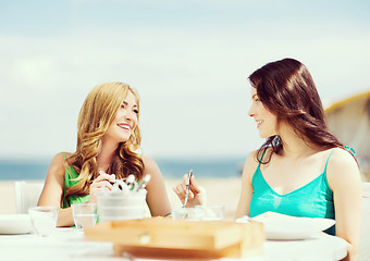 Image showing girls in cafe on the beach