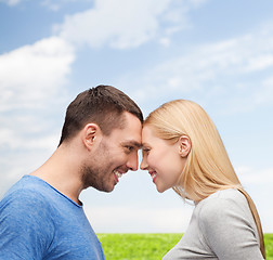 Image showing smiling couple looking at each other