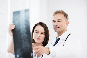 Image showing two doctors looking at x-ray