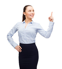 Image showing attractive young businesswoman with her finger up