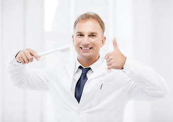 Image showing dentist with toothbrush in hospital