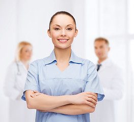 Image showing smiling female doctor or nurse