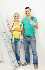 Image showing smiling couple doing renovations at home