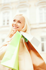 Image showing woman with shopping bags in city