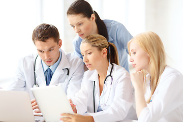 Image showing group of doctors with laptop and tablet pc