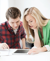 Image showing students looking at tablet pc at school