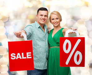 Image showing smiling couple with shopping bags