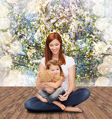 Image showing happy mother with adorable girl and teddy bear