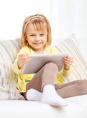 Image showing smiling girl with tablet pc computer at home