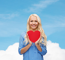 Image showing smiling woman with red heart