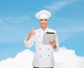 Image showing smiling female chef with tablet pc computer