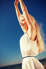 Image showing beautiful woman enjoying summer outdoors