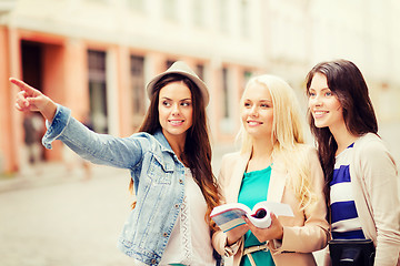 Image showing beautiful girls looking for direction in the city