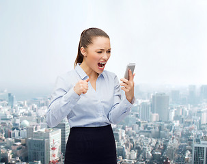 Image showing screaming businesswoman with smartphone