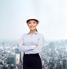 Image showing friendly smiling businesswoman in white helmet