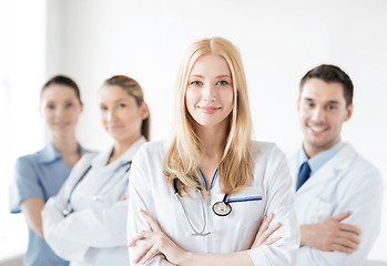 Image showing female doctor in front of medical group