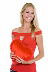 Image showing Happy young woman  holding a heart