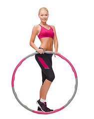 Image showing young sporty woman with hula hoop