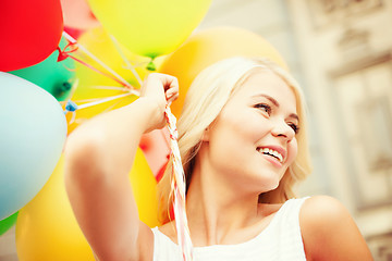 Image showing woman with colorful balloons