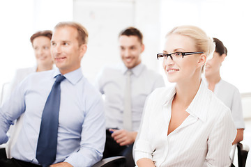 Image showing businessmen and businesswomen on conference